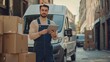 © Salander Studio - delivery guy in overalls holding a tablet standing next to a box of packages