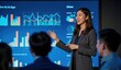 © Reubens Stock Photos - Confident Asian Female Executive Leading Presentation with Interactive Data Visuals