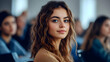 © Siasart Stock - Young woman with long curly hair, looking to the side, in a blurred background.