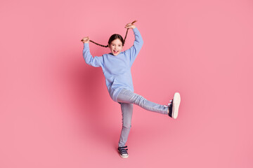 Poster - Full size photo of lovely small schoolkid dance pull braids wear hoodie isolated on pink color background