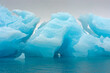 © Danita Delimont - Norway. Svalbard. Nordaustlandet Island. Brasvelbreen. Turquoise ice bergs in the calm water.