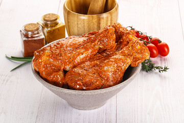 Poster - Raw turkey shoulder wing in Indian tandoori marinade