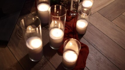 Wall Mural - candles on the floor in the restaurant near the table of newlyweds