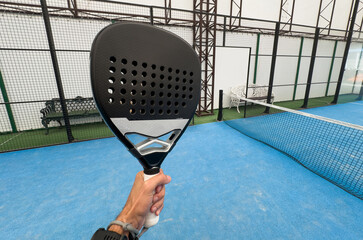 Wall Mural - paddle tennis player, hands and racket ready for serve