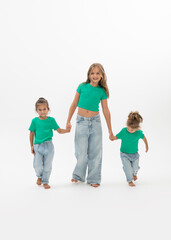 Three children holds hands, isolated on white background