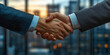 © icongor - Businessmen Shaking Hands in Front of a City Skyline at Sunset