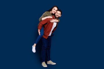 Sticker - Photo of cheerful positive married couple wife husband wear stylish clothes mall store isolated on dark blue color background