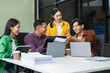 © NINENII - Group of Young Asian business team creative businesspeople coworker in office Happy to be successful partnership teamwork success concept.