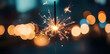 © Oksana - Glittering burning sparkler against blurred bokeh light background. New Year's Eve celebration