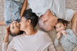 © peopleimages.com - Home, grandparents and kiss kids for love, care and people bonding together on floor above. Grandfather, grandmother and happy children relax in top view in lounge with family generations and sisters