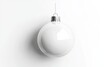 © Zaleman - An empty xmas ornament for a tree mockup. Christmas ball mockup isolated in 3D. Holiday sphere ornament for branding. New year decoration bal template. Blank white Christmas ball mockup isolated in