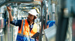 © CandyRetriever  - Professional Asian man engineer in safety uniform working on digital tablet at outdoor construction site rooftop. Industrial technician worker maintenance checking building exterior air HVAC systems.