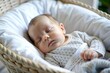 © N7 - Baby in Cradle - A serene portrait of a baby peacefully sleeping in a cradle.