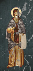 Traditional Christian icon of Saint Joanikije of Devic. Antique illustration on cracked wall in Byzantine style