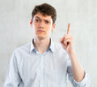 © caftor - Portrait of young guy gesturing in studio