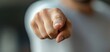 © rattapornkul - A close-up image of a person pointing with a finger, conveying a strong message or instruction in a modern context.