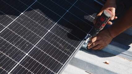 Wall Mural - Technicians install and secure solar panels on a rooftop. The process involves mounting and connecting the panels, ensuring a professional setup for renewable energy.