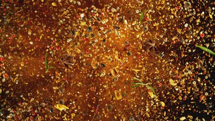 Poster - Super Slow Motion of Flying and Rotating Spice Mix. Isolated on Black Background. Filmed on High Speed Cinema Camera, 1000 fps, Placed on High Speed Cine Bot.