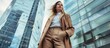 © hassan - Stylish businesswoman in coat and pants, skyscraper office background, clear sharp focus, magazine cover style.