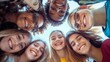 © Zivorad - Seven teenagers gather closely together, forming a circle and smiling brightly at the camera, showcasing their happiness, unity, and youthful energy in an outdoor setting.