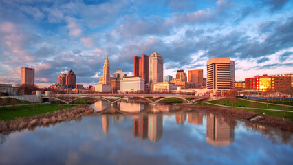 Wall Mural - Columbus, Ohio, USA. Cityscape image of Columbus, Ohio, USA downtown skyline with the reflection of the city in the Scioto River at spring sunset.