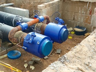 Replacement and repair of water supply pipes, heating mains, water pipes. The concept is a water supply accident. The valve is piped on the pipe. Photo 16:9.