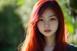 © Hew Pallot - photo of young asian woman with vibrant dyed red hair