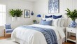 © Sharif54 - A cozy and inviting bedroom with a white wooden wall, a blue and white patterned vase with a plant, and a bed with white bedding and blue and white striped pillows.