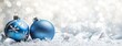 © K'kriang Krai - Light blue Christmas balls and silver decorations on white background with bokeh lights