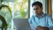 © Nattapol - Indian Man Working on Laptop at Home Office