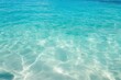 © KumCup - A serene view of clear blue ocean water with sunlight reflecting off the surface. Ideal for relaxation and tranquility.
