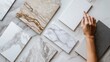 © irissca - Luxurious material samples for interior design, marble textures, high-end surfaces, architectural materials, elegant stone finishes, hand selecting tiles, premium quality