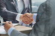 © Katsiaryna - Businessman handshake for teamwork of business merger and acquisition