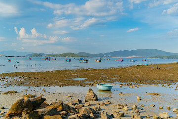 The sea ebb at sunset.
The coastline is the seabed. Seascape of Nha Trang suburb in Vietnam. 