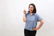 © ArvStd - Smiling happy good-looking asian girl giving advice, showing one finger as explain rules, make point, standing white background