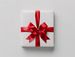 © Jana - White gift box with red ribbon bow isolated on white background