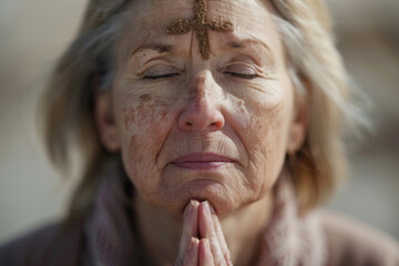 Close-up of woman forehead with ash cross, Christian concept