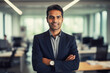 © rohappy - Portrait confident happy smiling Hispanic businessman standing in the office and looking at camera