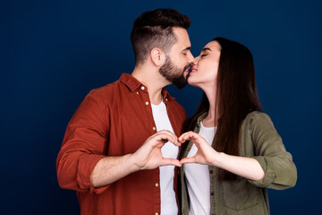 Canvas Print - Photo of cute tender lovely couple wife husband wear stylish clothes hug kiss romance isolated on dark blue color background