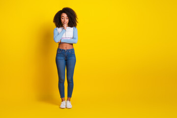 Sticker - Full size photo of pretty young girl minded look down empty space wear trendy blue outfit isolated on yellow color background