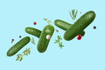 Poster - Ripe cucumbers, herbs and spices falling on light blue background