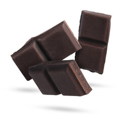 Wall Mural - Pieces of sweet chocolate falling on white background