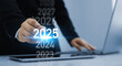 © Mer_Studio - Development business plan in 2025. Businessman choose on a virtual screen 2025.Business plan in company 2025.Development to business success and achievement in 2025 year.
