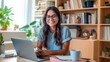© Muhammad - Smiling Woman Working On Laptop In Home Office