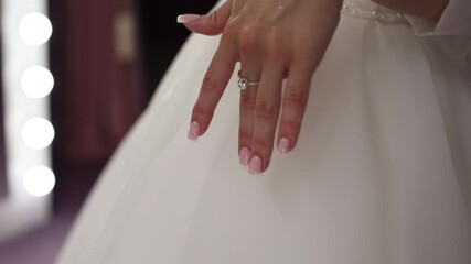 Poster - a wedding ring with a diamond on the hand of the bride