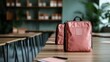© Dulemegapixel - An in-focus image showcasing trendy orange school bags placed neatly on desks, highlighting the modern classroom setup and the importance of education.