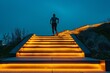 © neirfy - runner running up the stairs, which glow with yellow lights against the background of a dark blue sky at night.