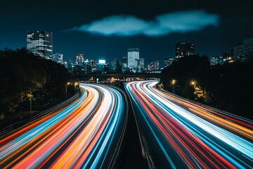 Canvas Print - A long exposure photograph of light trails on a highway, Motorway and Junction in a big city. At night, high speed motion blur, light trails on a motorway highway.