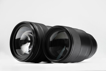 Canvas Print - Camera lens on white background. Photographer's equipment