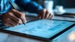 © Jack - A close-up of a product manager’s hands working on a Gantt chart on a tablet, with project timelines and milestone markers clearly visible, in a minimalist workspace